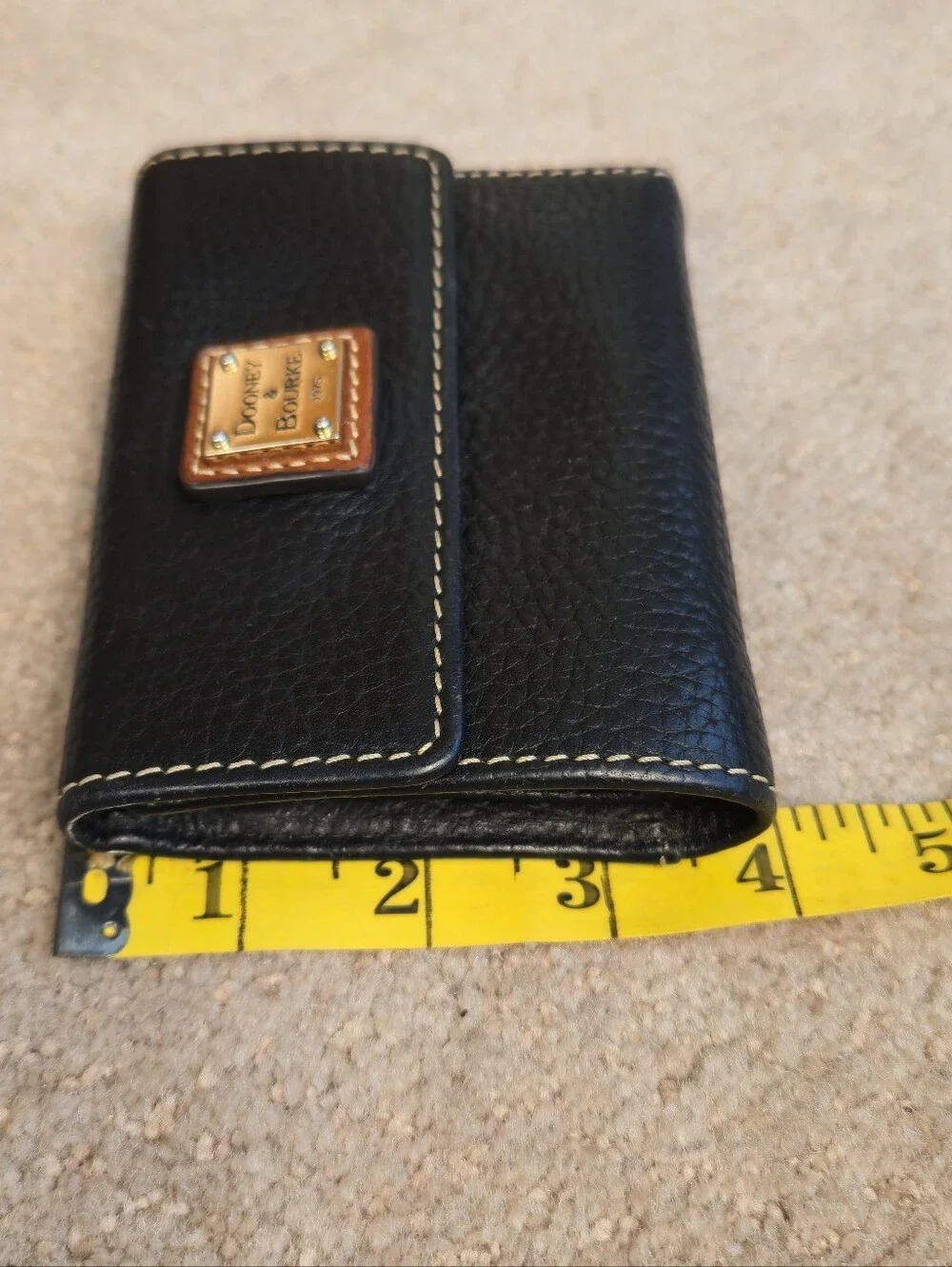 Dooney & Bourke Pebble Grain Leather Small Flap Wallet / Black / 4” x 4.5”